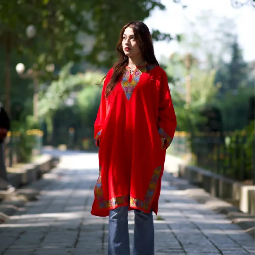 Red kaftan portrait on a garden path
