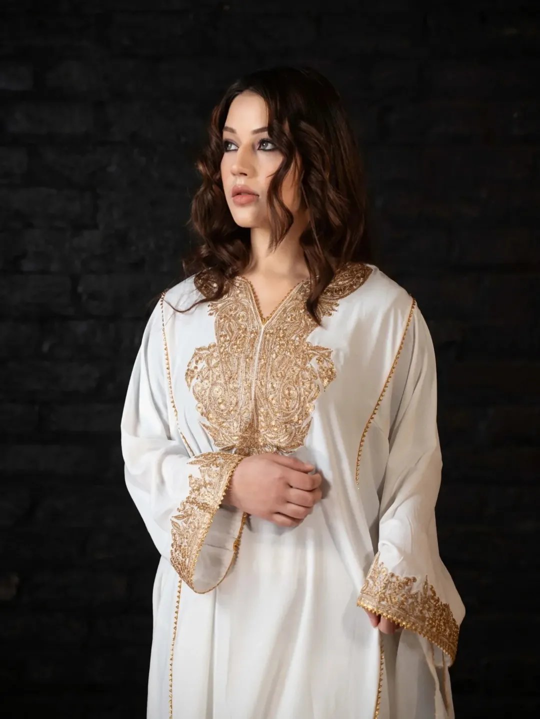 Marsha Ajaz portrait in white embroidered kaftan